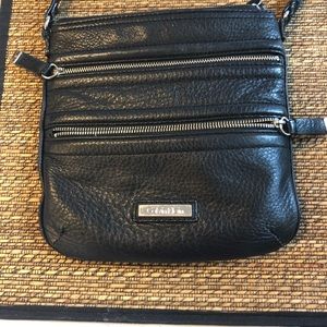 Calvin Klein cross many zippers bag.